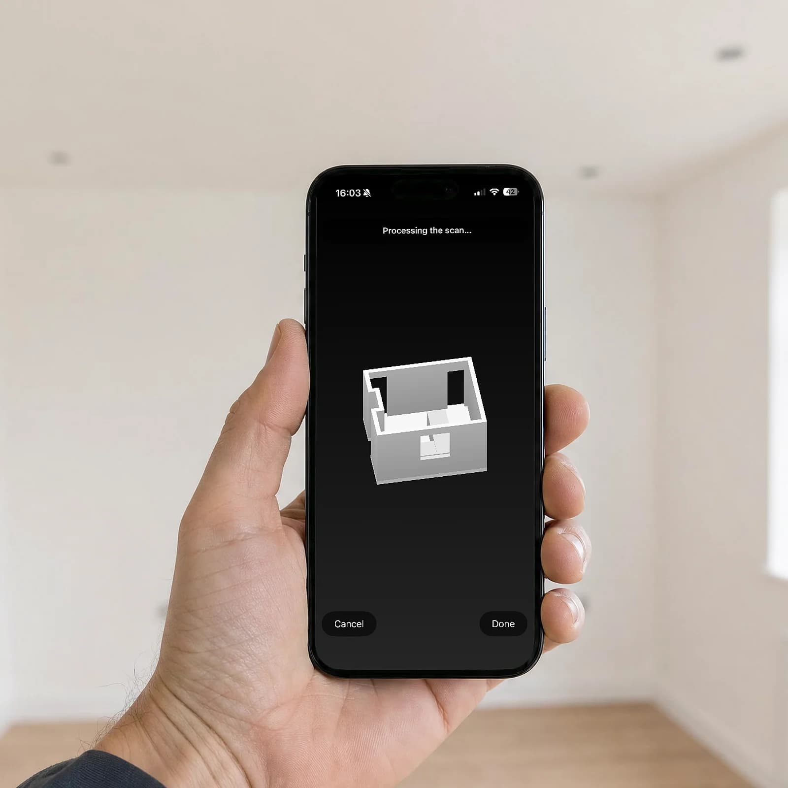 A hand holding an iPhone in an empty room, the Vento app showing the room it has just scanned as a 3D model with its openings